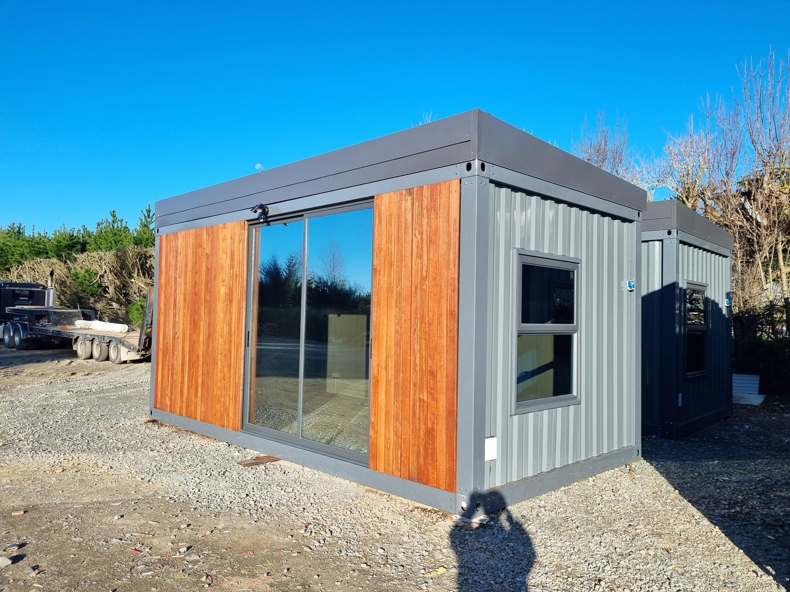 Donald 6m cabin exterior with cedar cladding and sliding glass doors